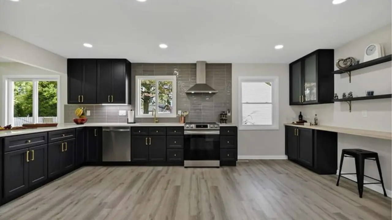 Finished kitchen with coordinated cabinets and flooring plus material samples showing how a kitchen cabinet store helps match cabinets with flooring.