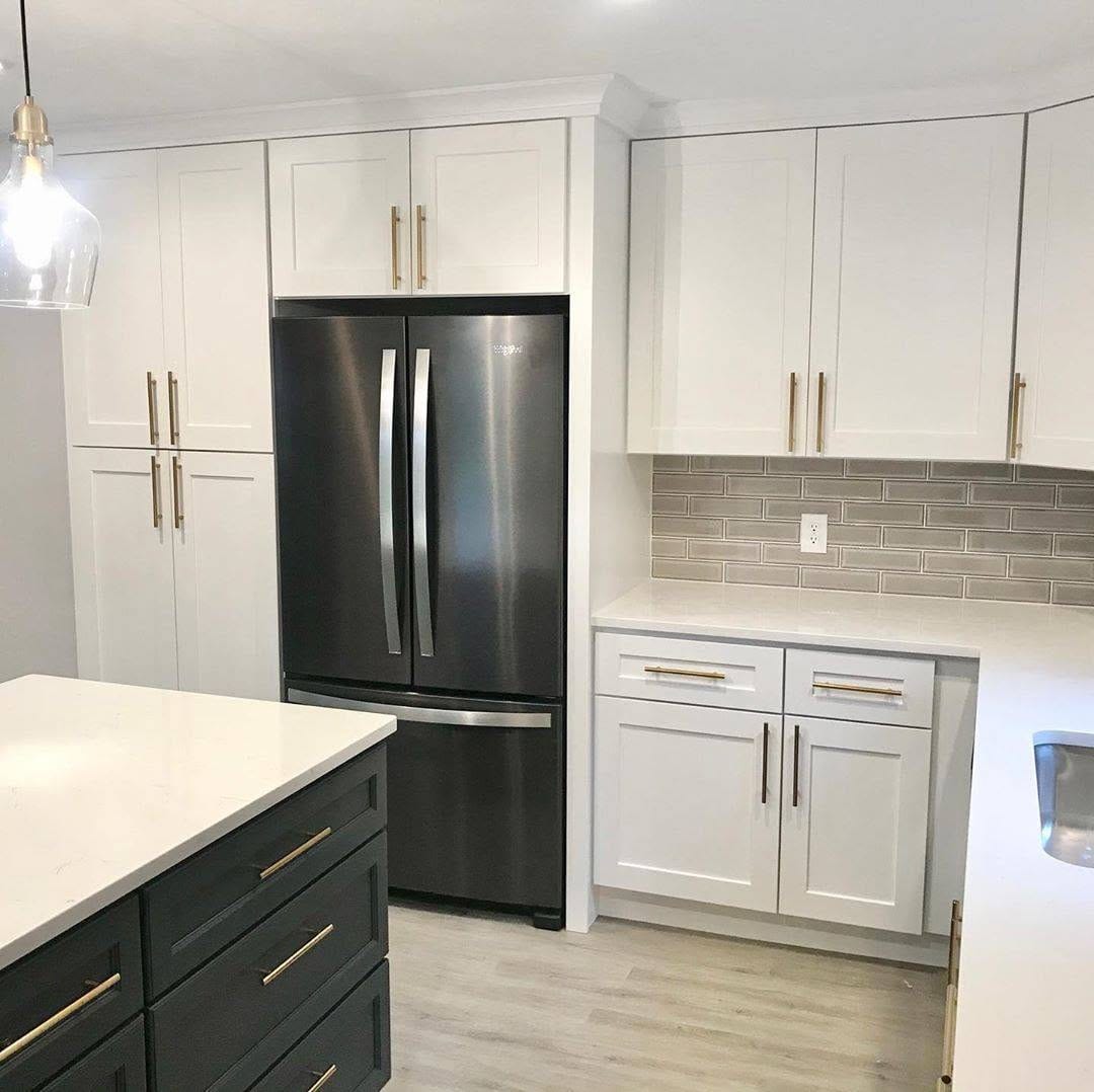 Charcoal island with white Shaker cabinetry in Bedford Ohio