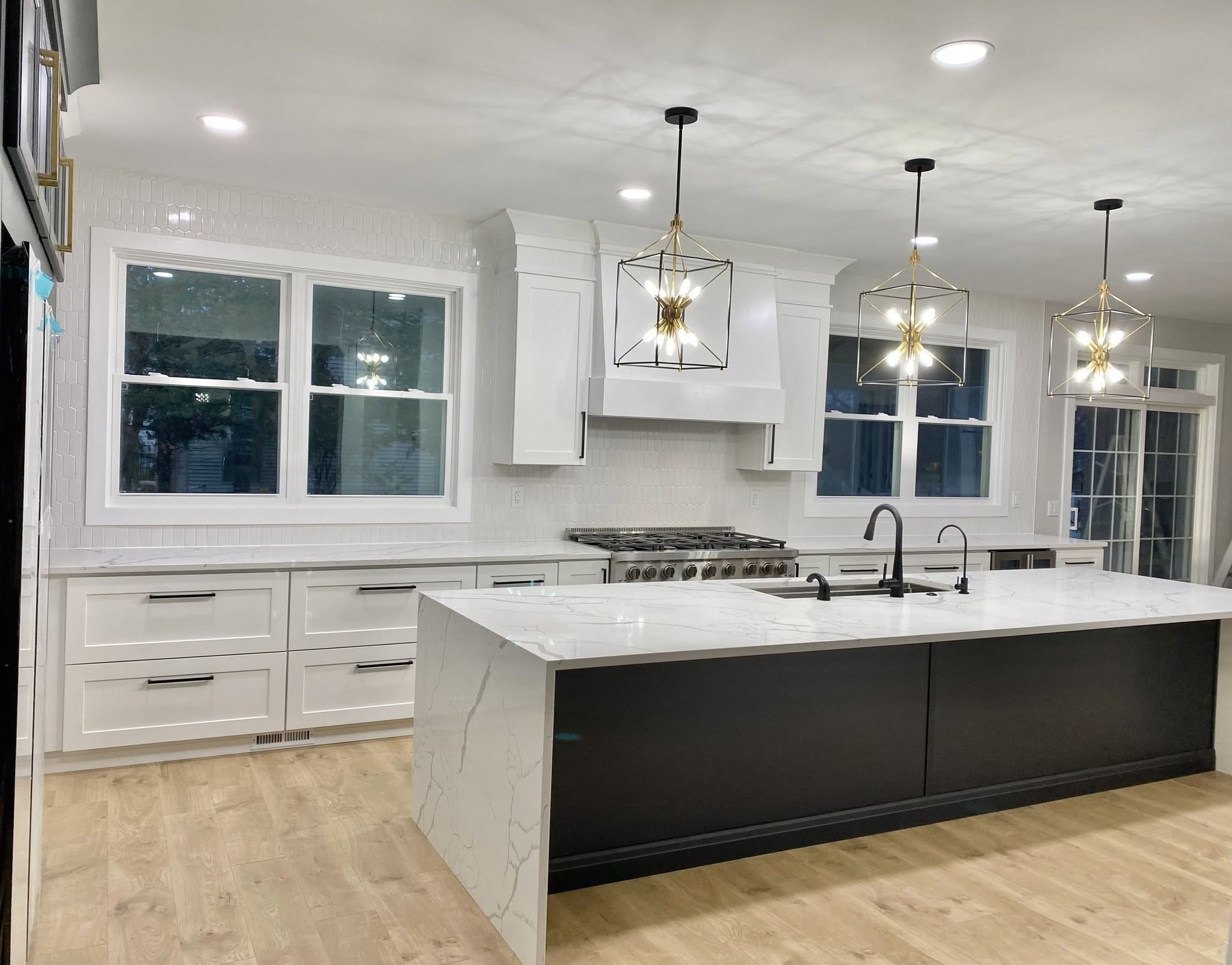 Shaker White cabinets with a waterfall island in a Grafton Ohio kitchen