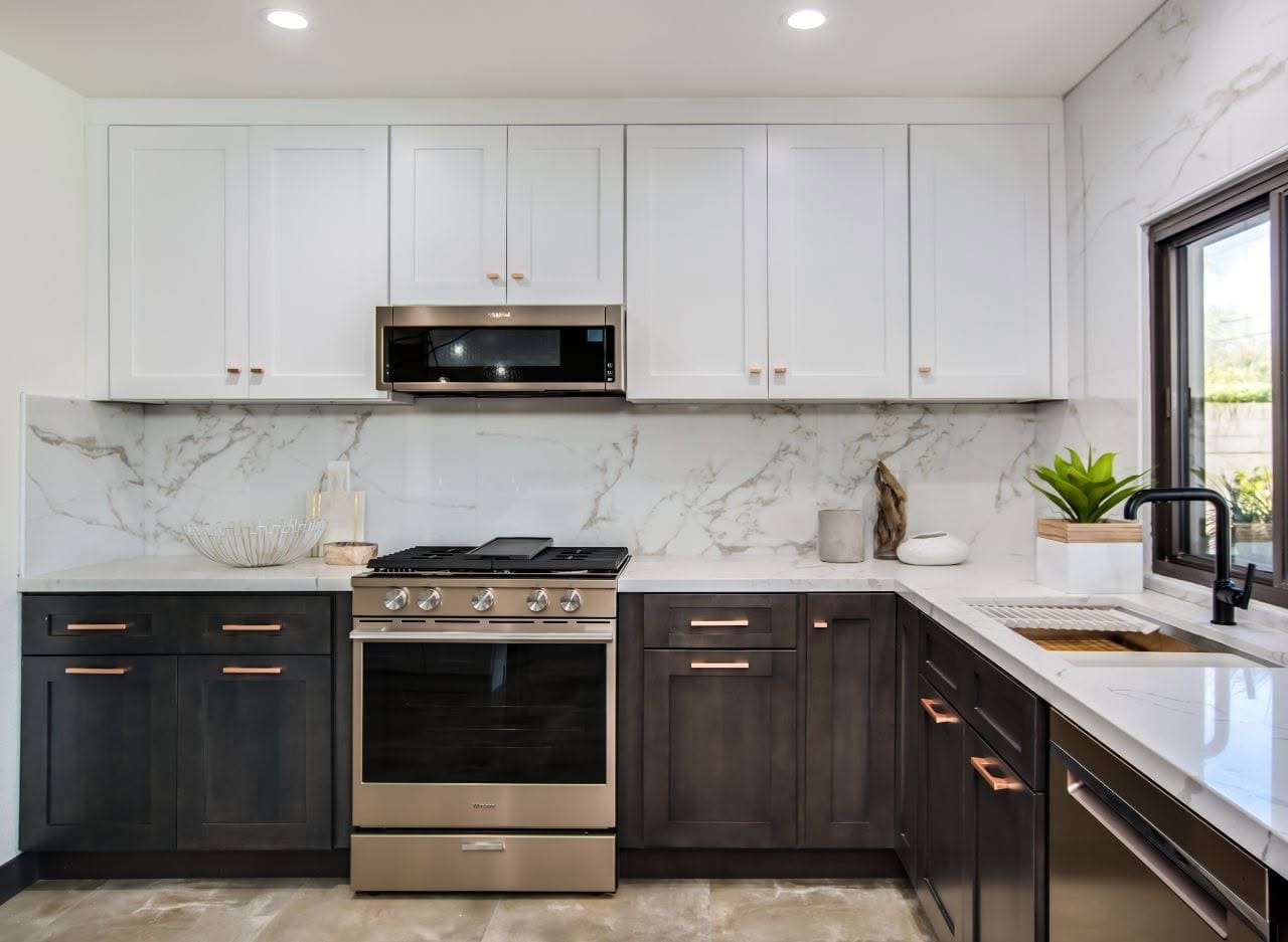 Two toned kitchen with greystone base and White Shaker upper cabinets North Olmsted Ohio