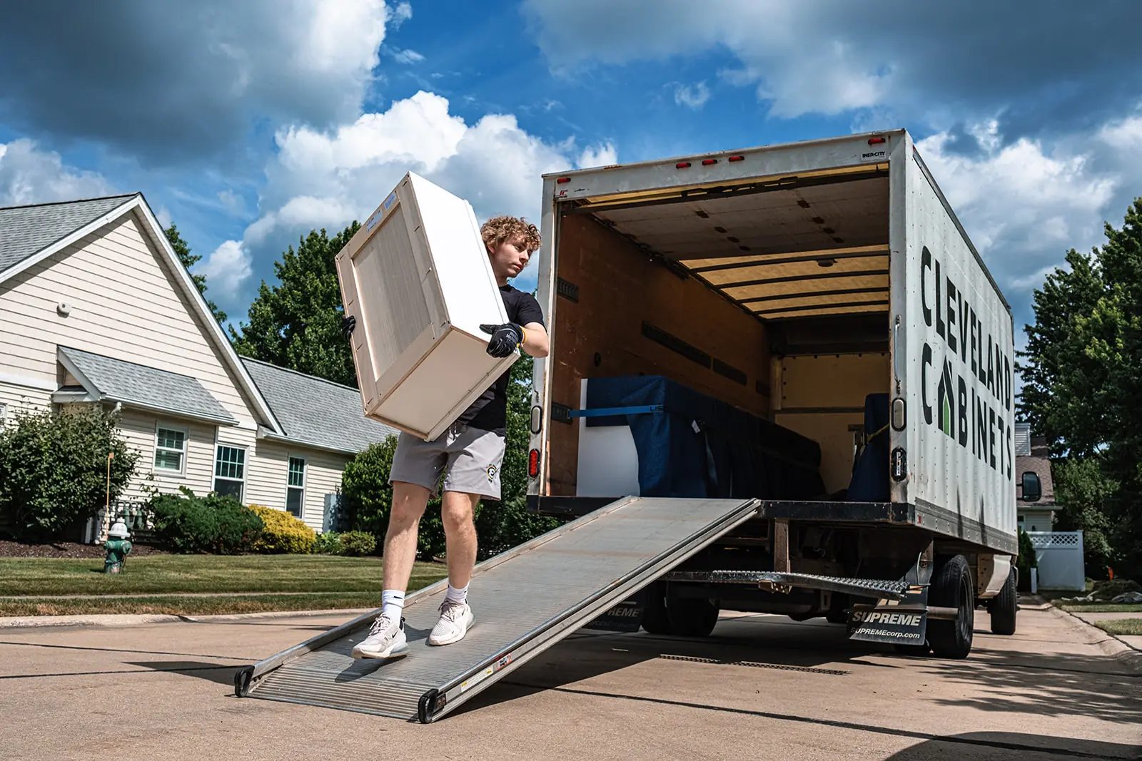 Worker delivering cabinet boxes to a North Ridgeville Ohio home