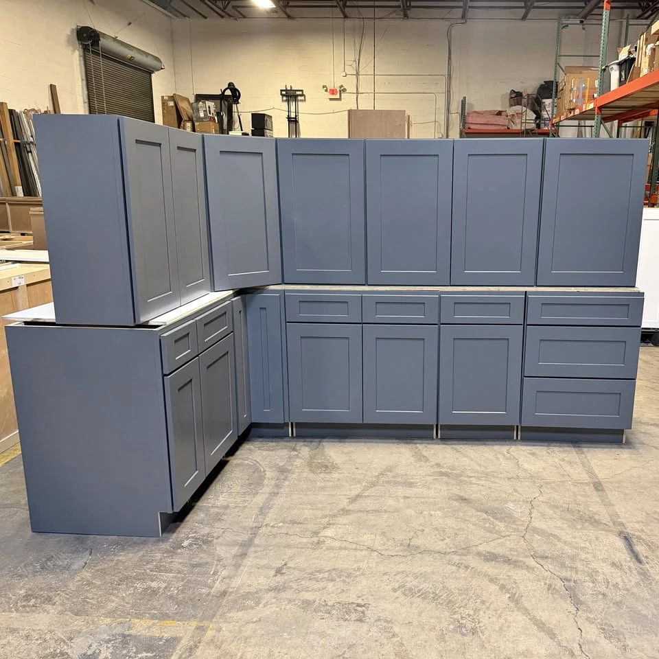 Grey Shaker L shaped kitchen cabinet set with plywood boxes at the RTA Cabinets Ohio warehouse in Cleveland