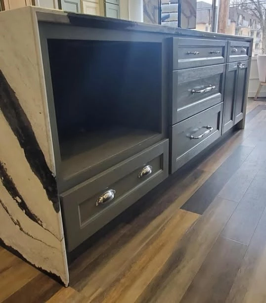 Charcoal gray Shaker kitchen island with waterfall edge and silver hardware, Cleveland showroom