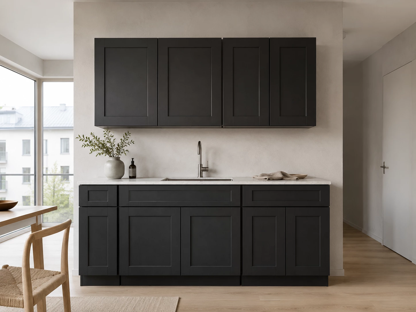 Black Shaker cabinets in a skylit galley kitchen in Cleveland, Ohio