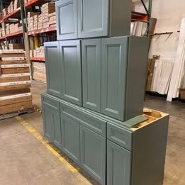 Full set of Sage Green Shaker RTA kitchen cabinets at the RTA Cabinets Ohio warehouse in Cleveland