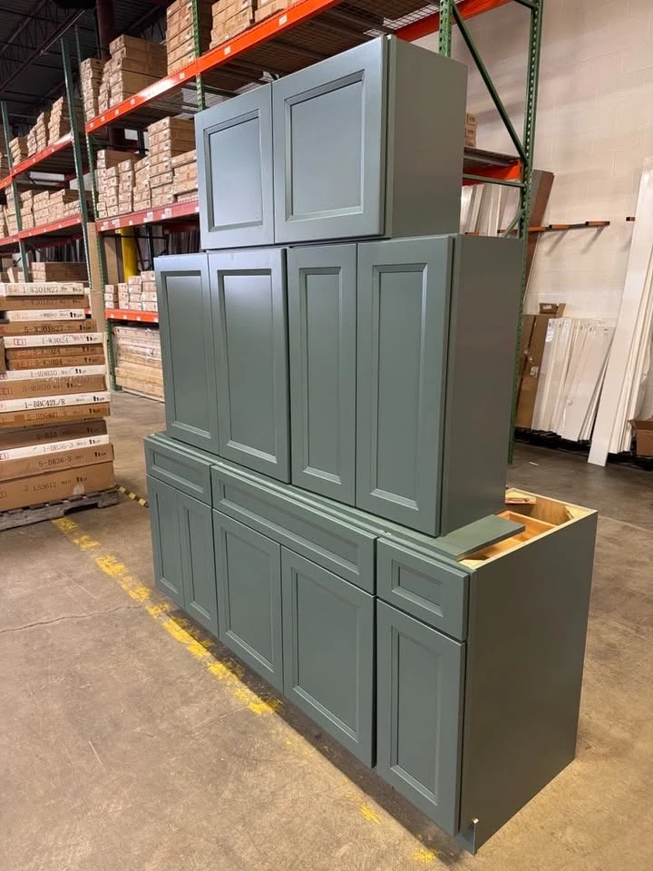 Green ready-to-assemble kitchen cabinet set on display in the Cleveland showroom