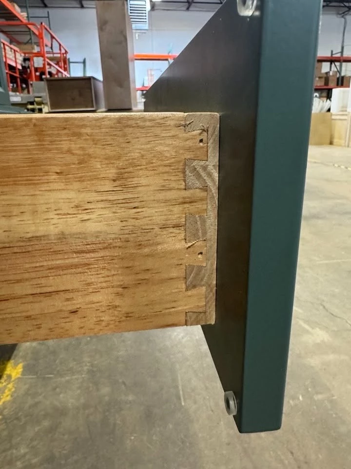 Dovetail drawer box construction on the green kitchen cabinets, Cleveland, Ohio