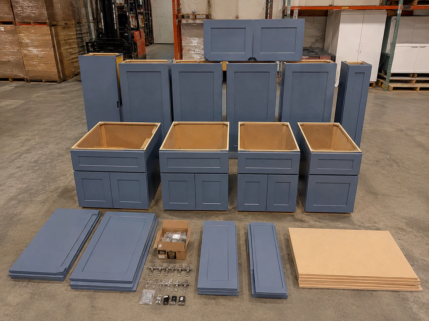 Unassembled grey RTA cabinet panels and hardware at the Cleveland warehouse